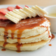 Pancakes with bananas and strawberries